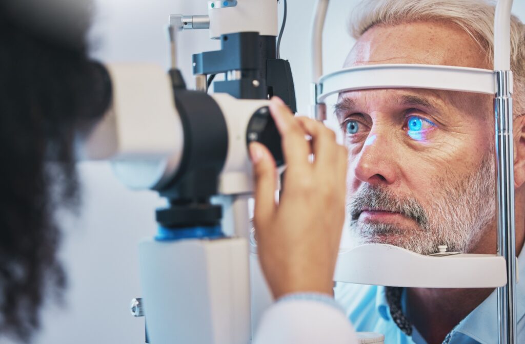 A senior man having his eyes checked by an optometrist to see how cigarettes have affected his eyesight.