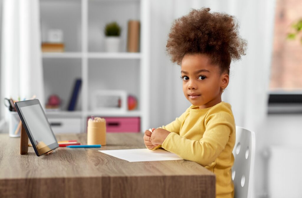 A child doing schoolwork in a healthy visual environment