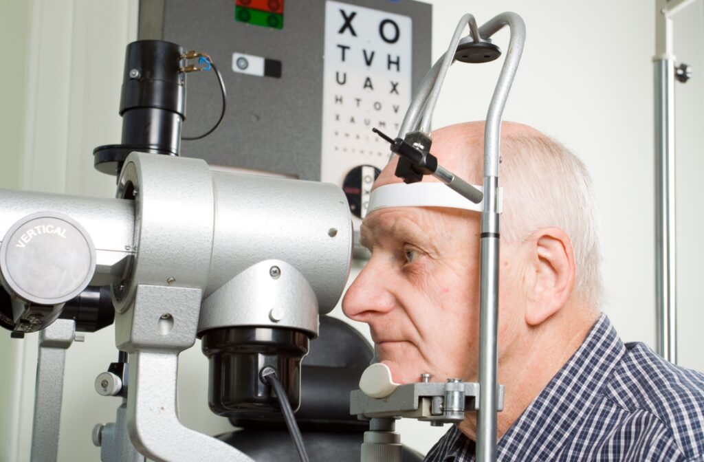 Senior man having an eye exam during a routine check-up to screen for cataracts.
